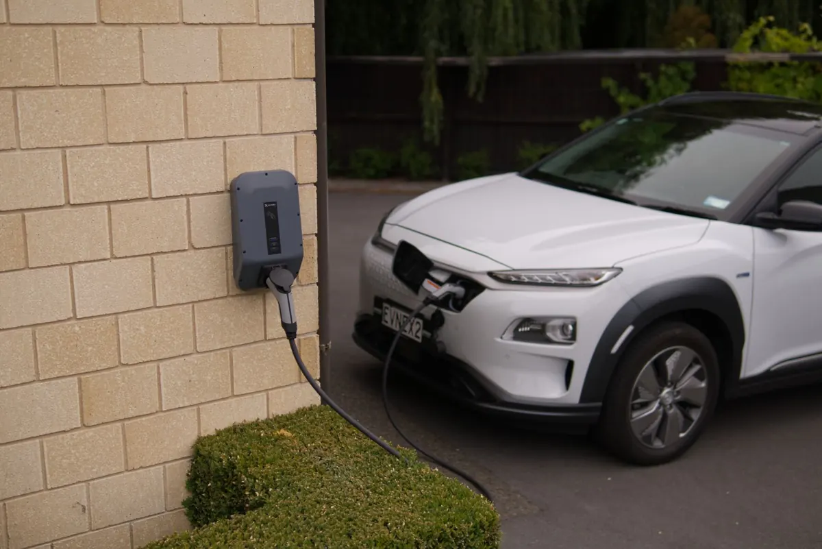 Level 2 home EV charger plugged into an electric SUV