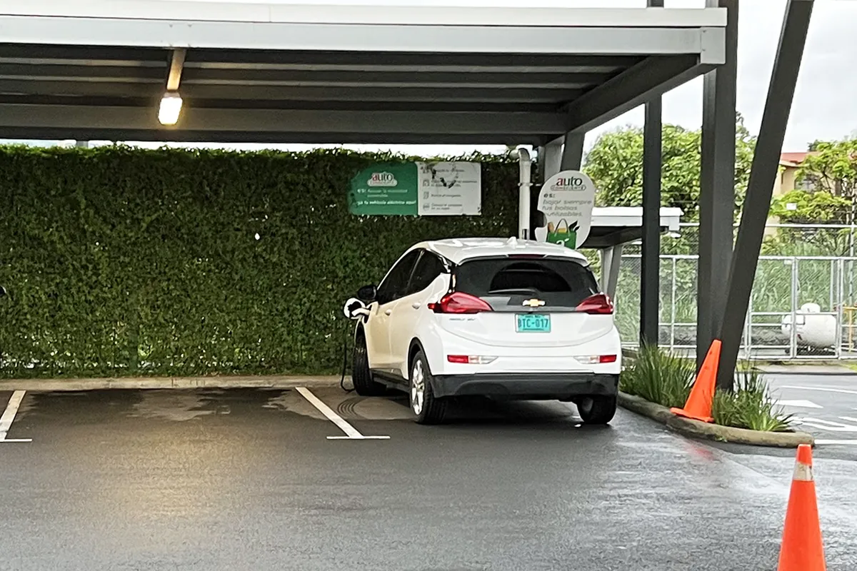 White Chevrolet Bolt EV parked at an EV charging station