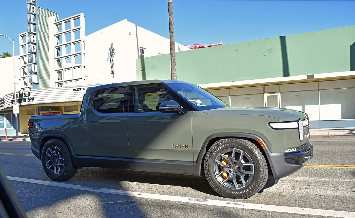 Rivian R1T electric pickup truck parked on a city street