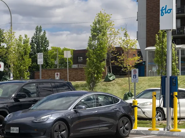 Tesla Model 3 plugged in at a Level 2 charging station