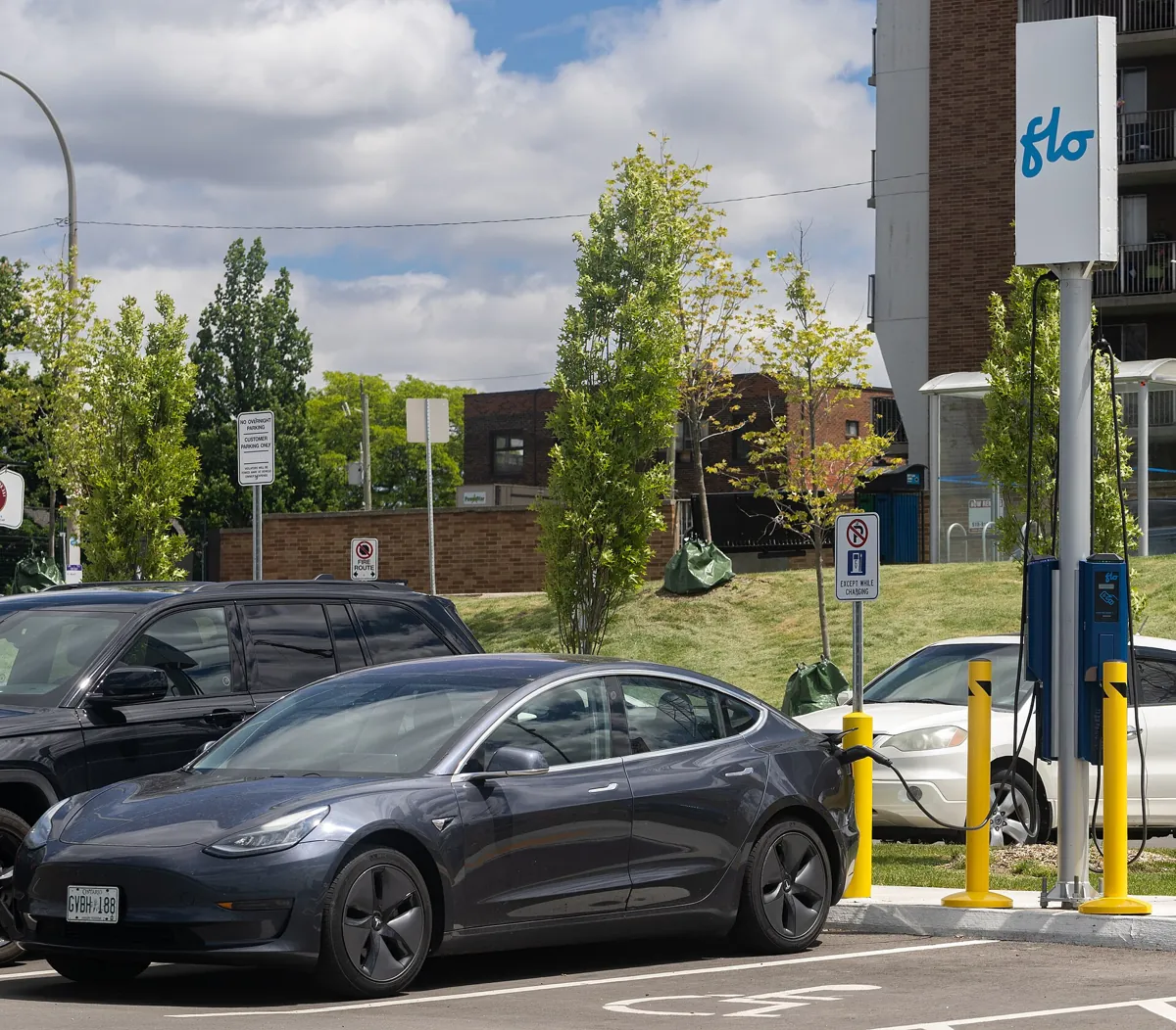 Tesla Model 3 plugged in at a Level 2 charging station